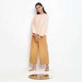 Front View of a Model wearing Powder Pink Straight Top and Rust Pant Set