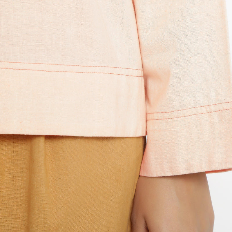 Close View of a Model wearing Powder Pink Straight Top and Rust Pant Set