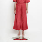 Front View of a Model wearing Brick Red Vegetable Dyed 100% Cotton Wide Legged Pant