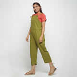 Left View of a Model wearing Red Boat Neck Top and Olive Green Dungaree Set