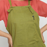 Front Detail of a Model wearing Red Boat Neck Top and Olive Green Dungaree Set