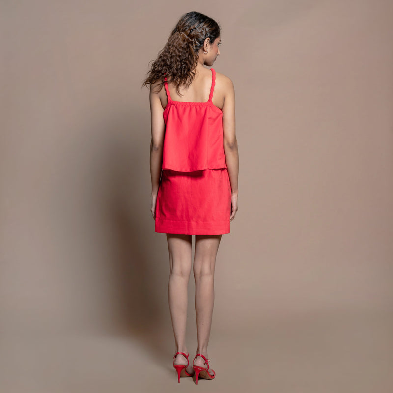 Back View of a Model wearing Red Cotton Velvet Halter Neck Flared Top