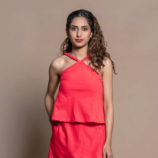 Front View of a Model wearing Red Cotton Velvet Halter Neck Flared Top