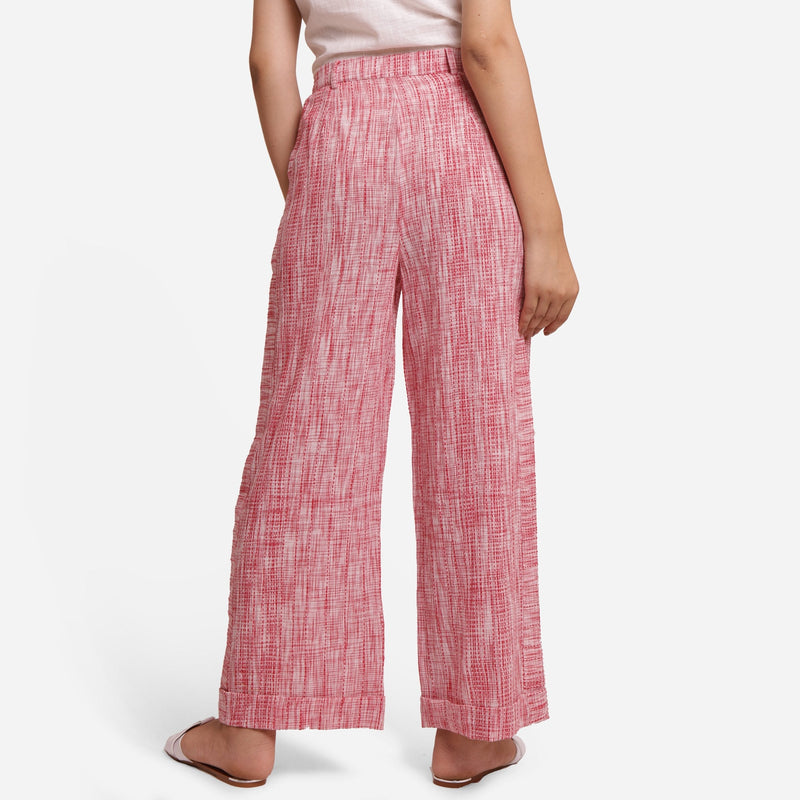 Back View of a Model wearing Red Crinkled Cotton Ankle Length Pant