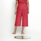 Back View of a Model wearing Mid-Rise Vegetable Dyed Red Cotton Culottes