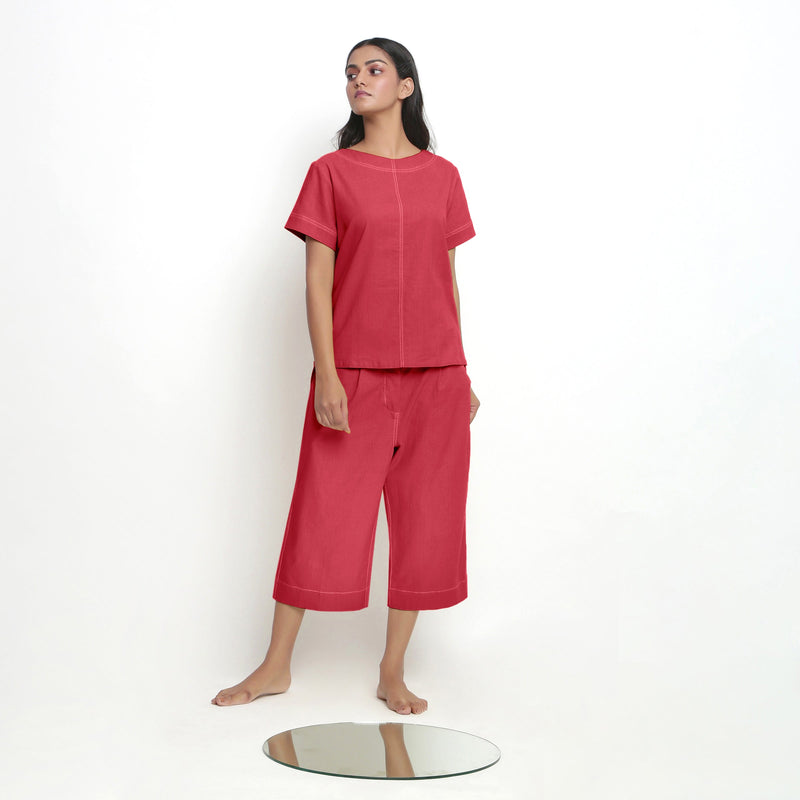 Front View of a Model wearing Red Paneled Top and Mid-Rise Culottes Set