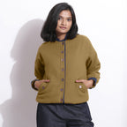 Front View of a Model wearing Reversible Green Blue Waffle Bomber Jacket