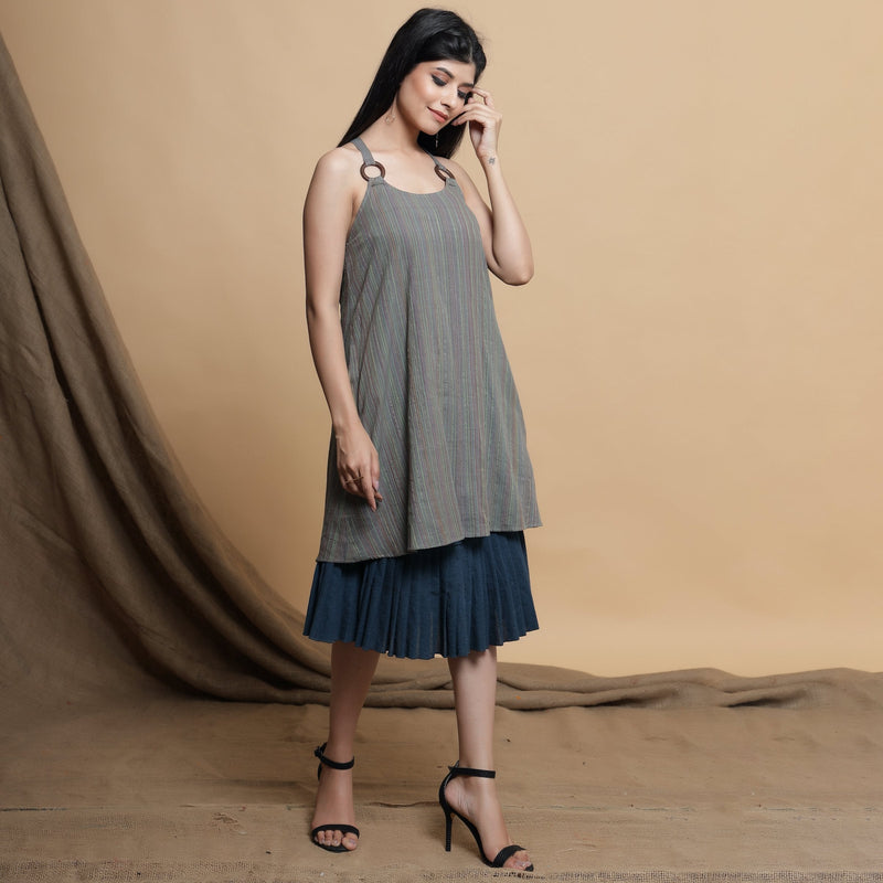 Right View of a Model wearing Reversible Pleated Knee Length Dress