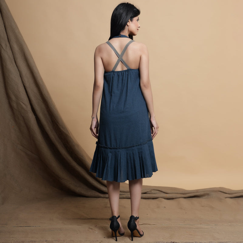 Back View of a Model wearing Reversible Pleated Knee Length Dress