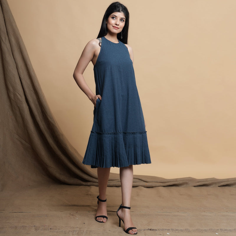 Front View of a Model wearing Reversible Pleated Knee Length Dress