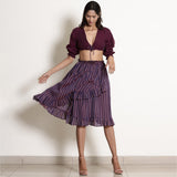 Front View of a Model wearing Reversible Plunge Neck Top and Wrap Skirt Set