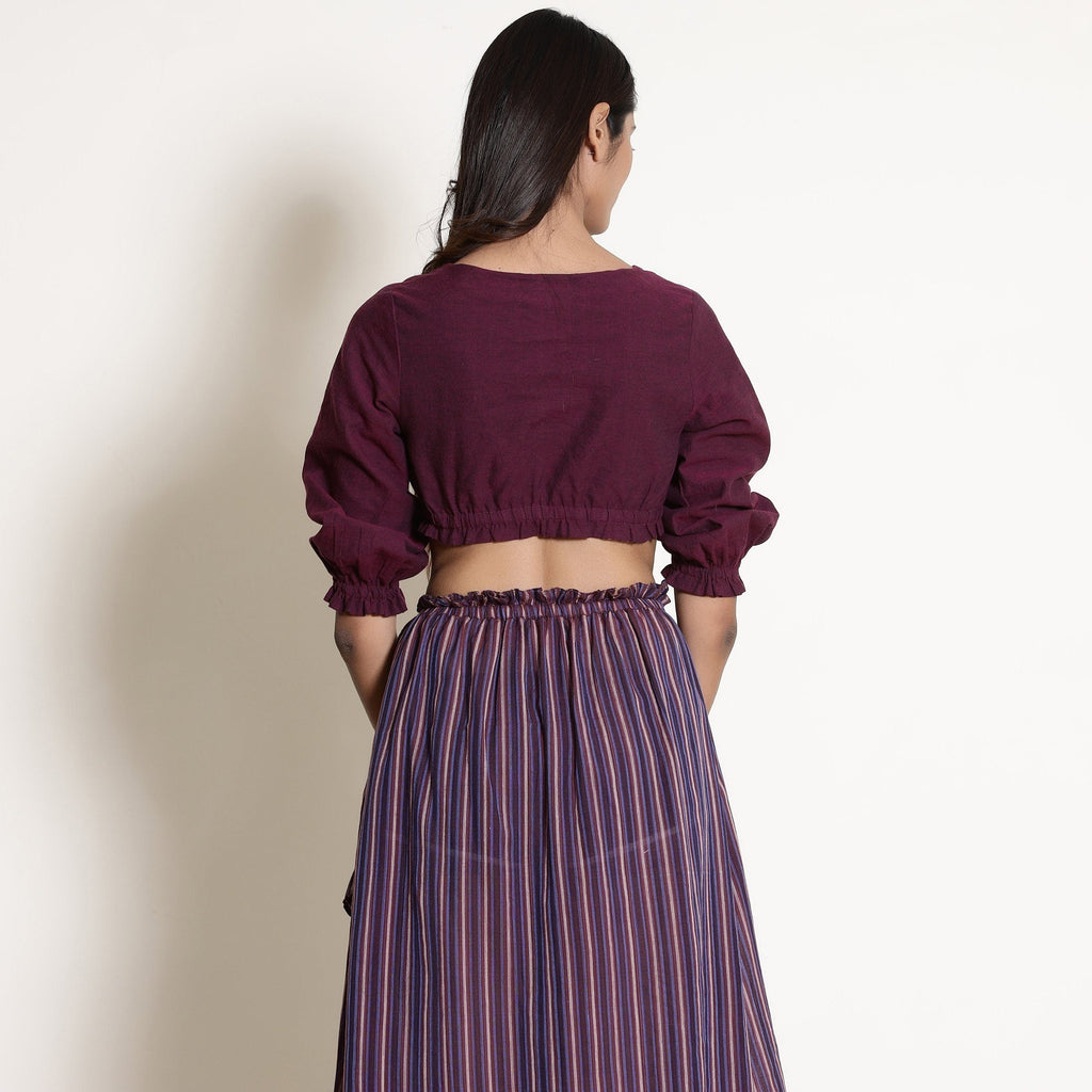 Back View of a Model wearing Reversible Plunge Neck Top and Wrap Skirt Set