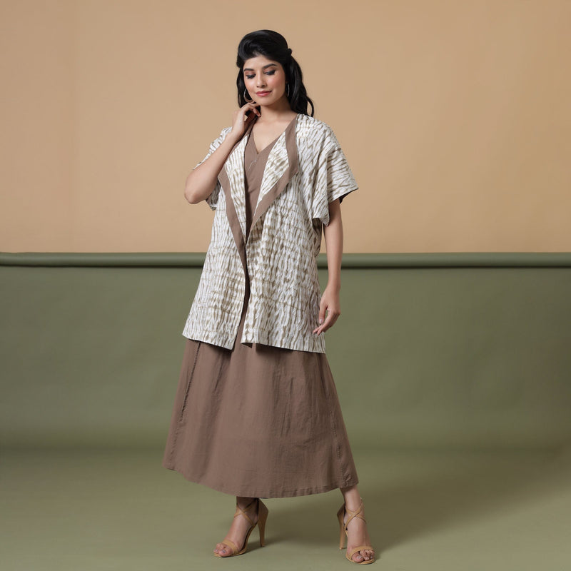 Front View of a Model wearing Reversible Shibori Wrap Dress and Overlay Set
