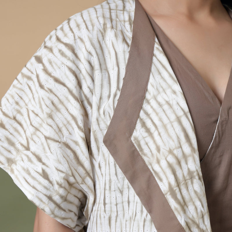 Front Detail of a Model wearing Taupe Shibori Front Open Overlay