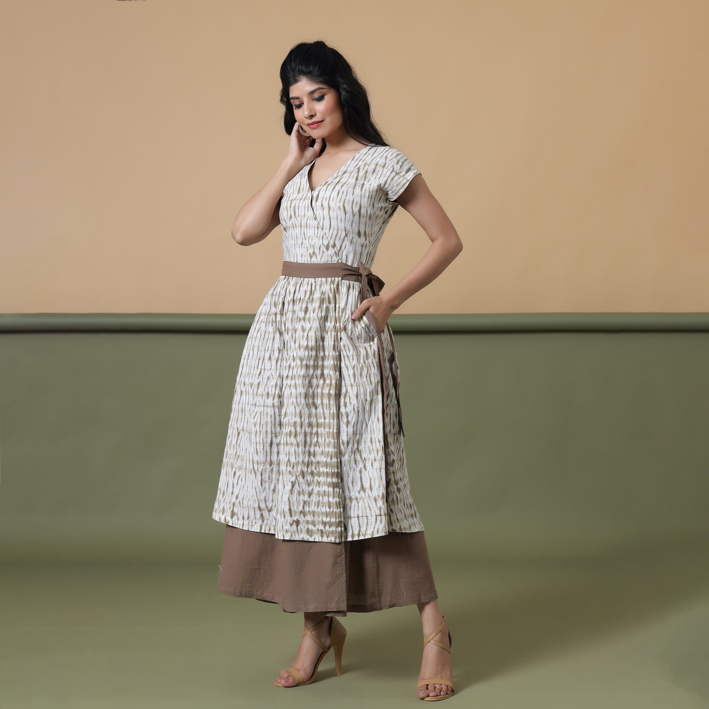 Front View of a Model wearing Taupe Shibori Front Open Overlay