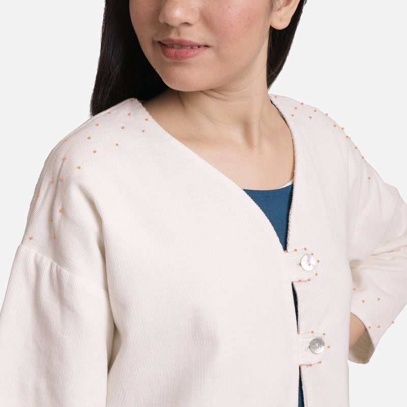 Front Detail of a Model wearing Reversible White Hand Beaded Jacket