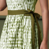Front Detail of a Model wearing Reversible Shibori Olive Green Wrap Dress