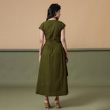 Back View of a Model wearing Reversible Shibori Olive Green Wrap Dress