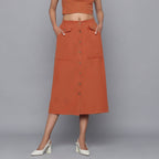 Front View of a Model wearing Sunset Rust Button-Down Midi Skirt