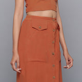 Right View of a Model wearing Sunset Rust Button-Down Midi Skirt