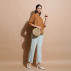 Right View of a Model wearing Rust Cotton Muslin Solid Handspun Top