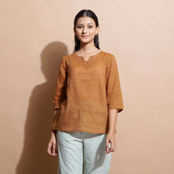 Front View of a Model wearing Rust Cotton Muslin Solid Handspun Top
