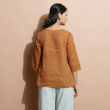 Back View of a Model wearing Rust Cotton Muslin Solid Handspun Top