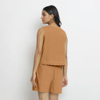 Back View of a Model wearing Rust Handspun Vegetable Dyed Crop Top