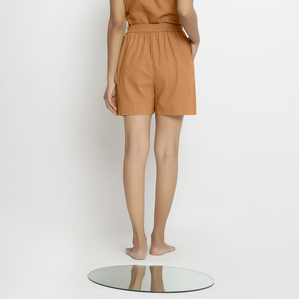 Back View of a Model wearing Rust Vegetable Dyed Handspun Short Shorts