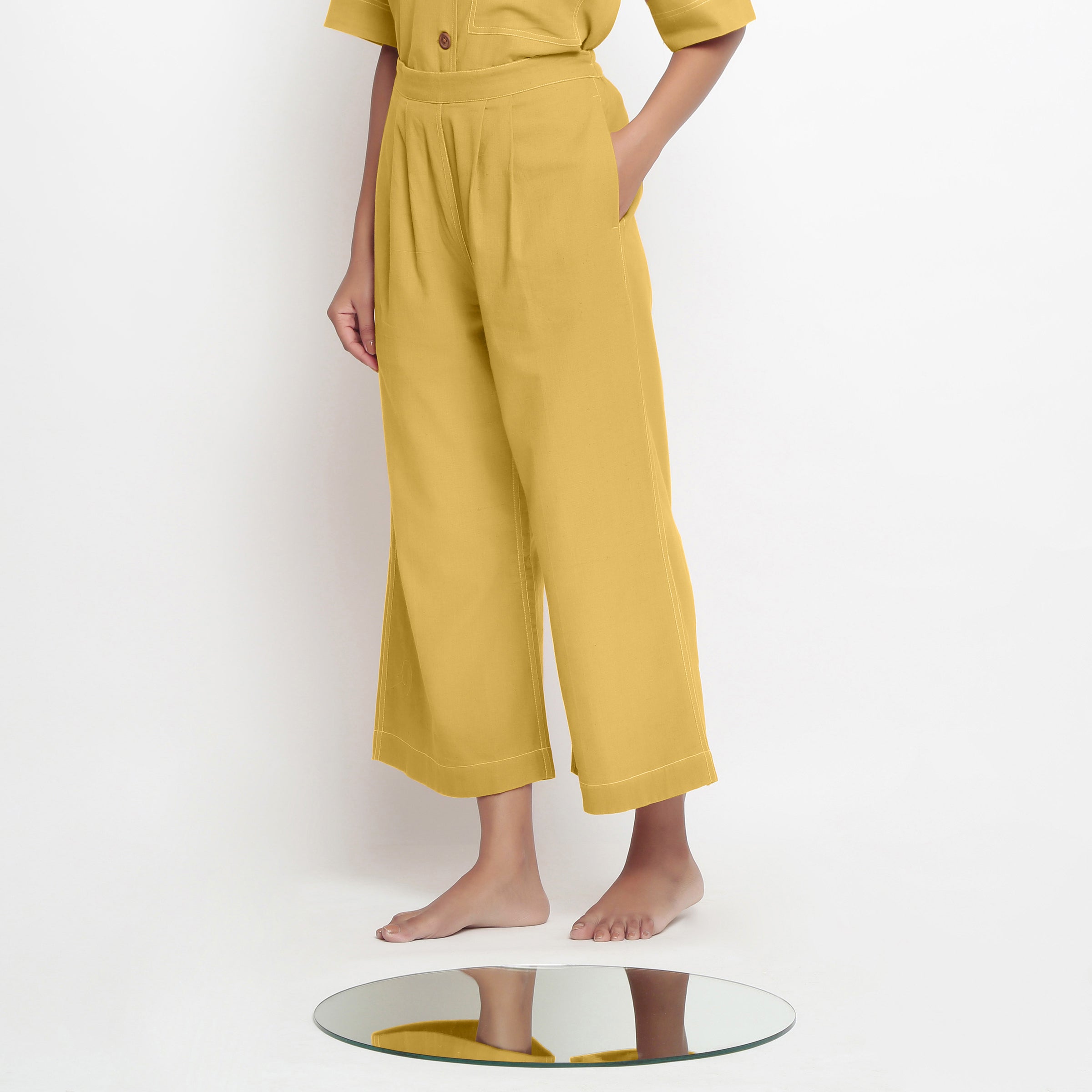Left View of a Model wearing Light Yellow Vegetable Dyed Wide Legged Pant