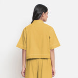 Back View of a Model wearing Rust Vegetable Dyed Handspun Cotton Shirt