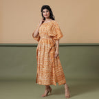 Left View of a Model wearing Rust Sandstone Shibori Kaftan Dress