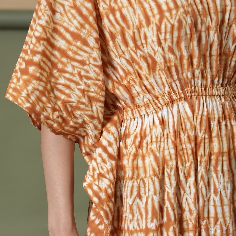 Front Detail of a Model wearing Rust Sandstone Shibori Kaftan Dress