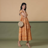 Right View of a Model wearing Rust Shibori Elasticated Gathered Dress