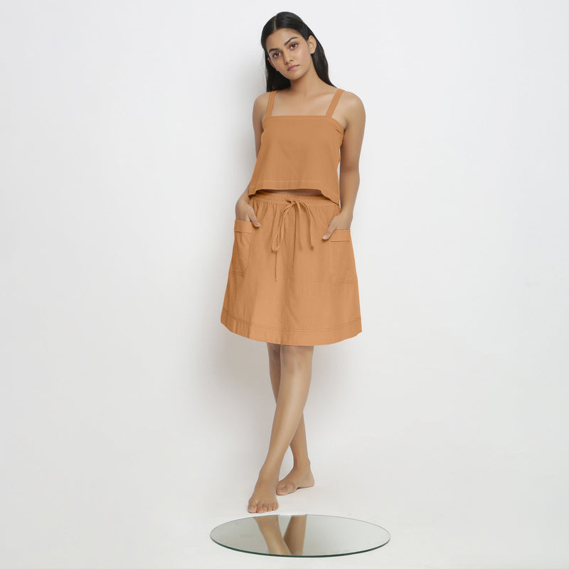 Front View of a Model wearing Rust Spaghetti Top and Mid-Rise Skirt Set