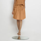 Front View of a Model wearing Vegetable-Dyed Rust 100% Cotton Mid-Rise Skirt