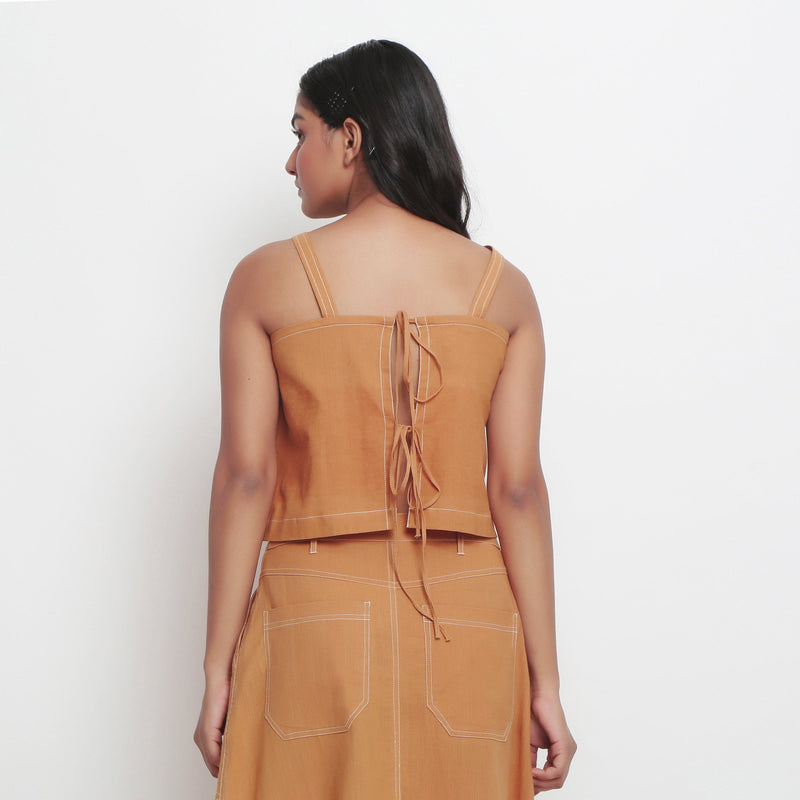 Back View of a Model wearing Rust Handspun Cotton Spaghetti Top