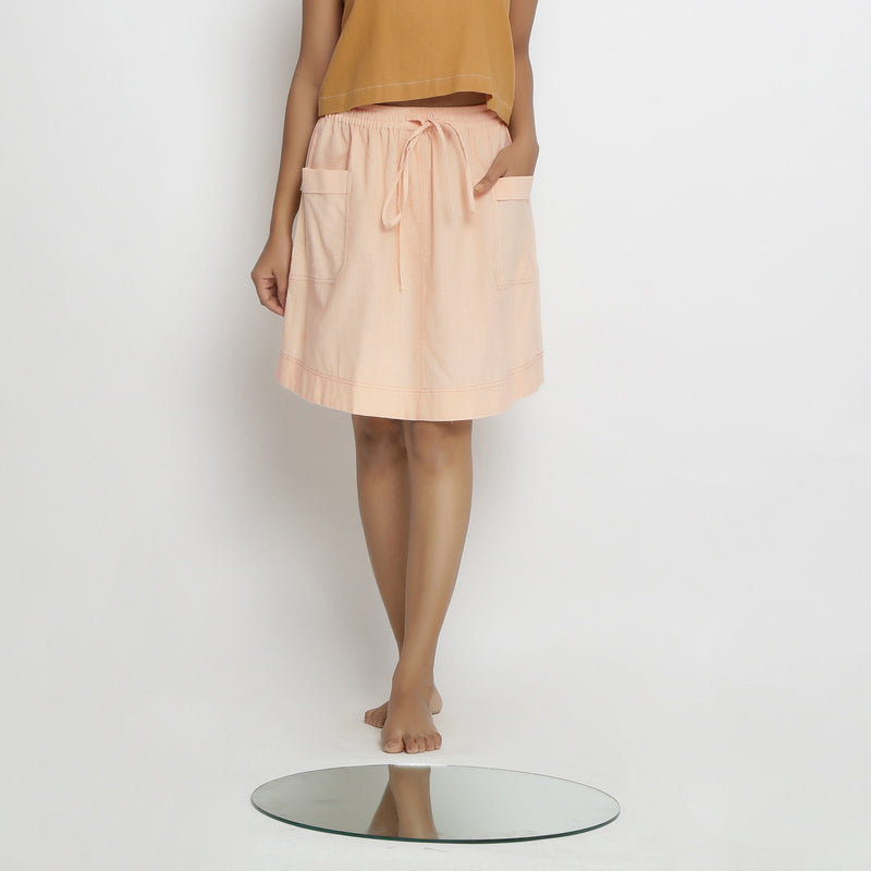 Front View of a Model wearing Vegetable Dyed Powder Pink Mid Rise Skirt