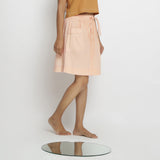 Right View of a Model wearing Vegetable Dyed Powder Pink Mid Rise Skirt