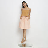 Front View of a Model wearing Rust Spaghetti Top and Powder Pink Skirt Set