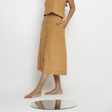 Left View of a Model wearing Rustic Vegetable Dyed Button-Down Skirt