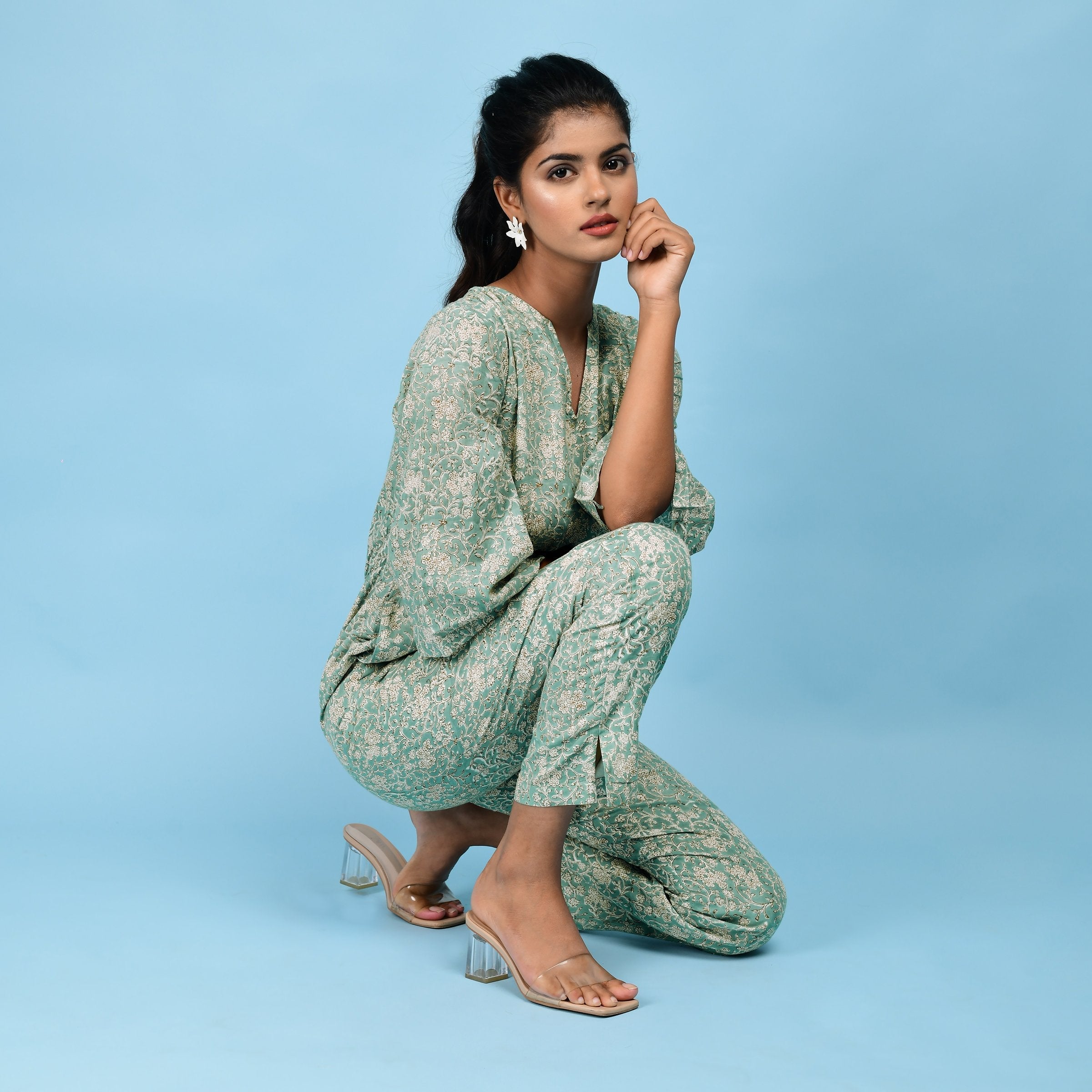 Right View of a Model wearing Sage Green Block Printed 100% Cotton Straight Jumpsuit