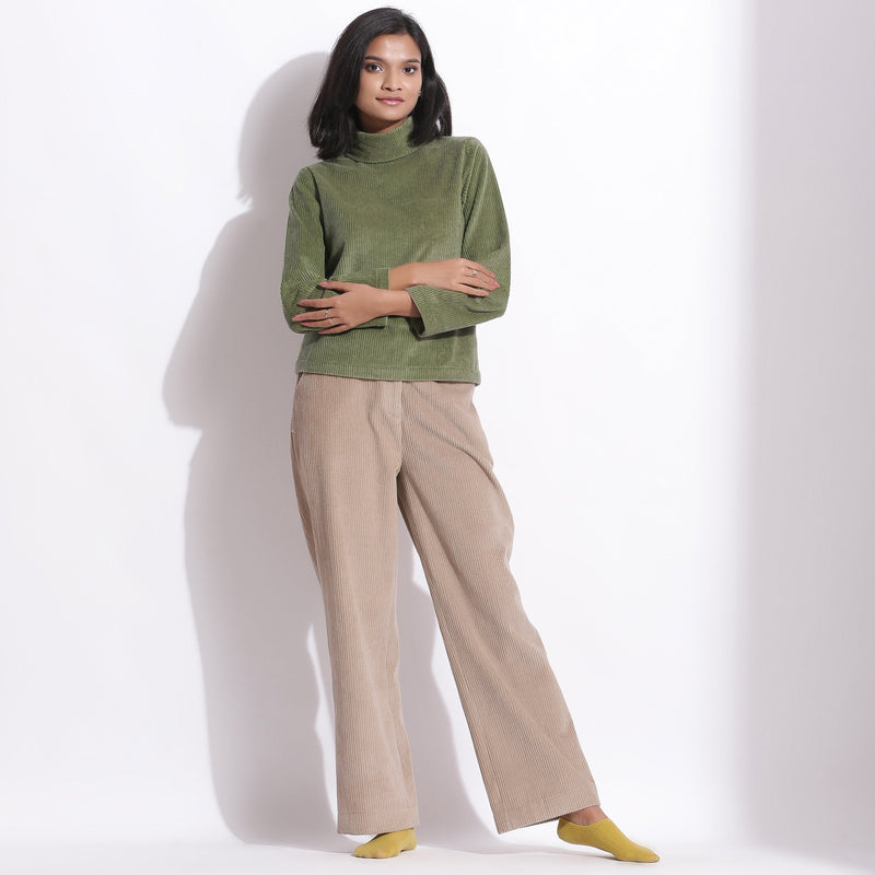 Front View of a Model wearing Sage Green Corduroy High Neck Top