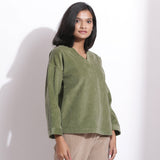 Right View of a Model wearing Sage Green Cotton Corduroy V-Neck Top