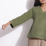 Front Detail of a Model wearing Sage Green Cotton Corduroy V-Neck Top