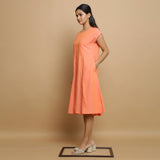 Left View of a Model wearing Salmon Pink Cotton Button-Down Dress