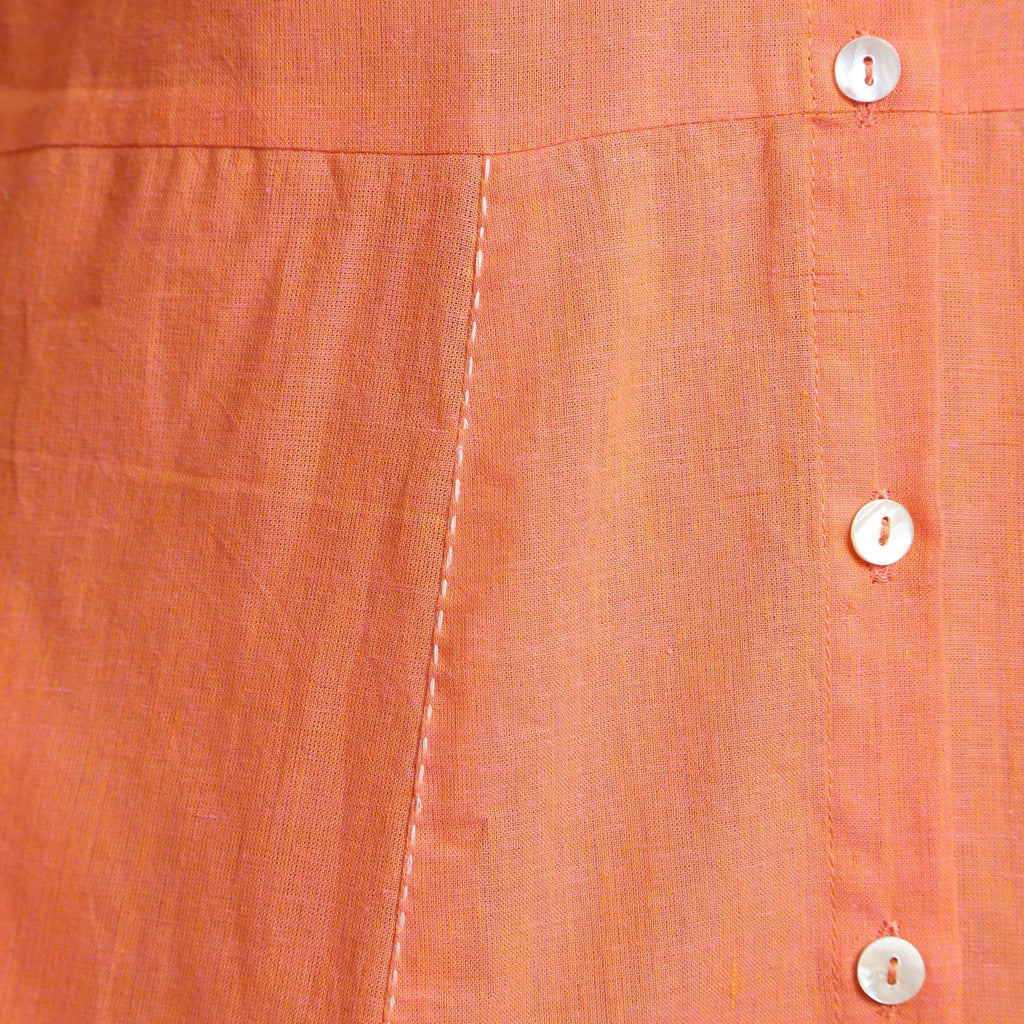 Close View of a Model wearing Salmon Pink Cotton Button-Down Dress