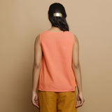 Back View of a Model wearing Salmon Pink Hand-Embroidered Flared Top