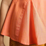 Close View of a Model wearing Salmon Pink Hand-Embroidered Flared Top