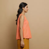 Right View of a Model wearing Salmon Pink Hand-Embroidered Flared Top
